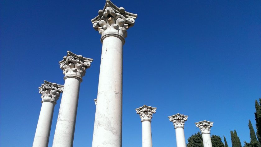 classic stone columns on blue sky